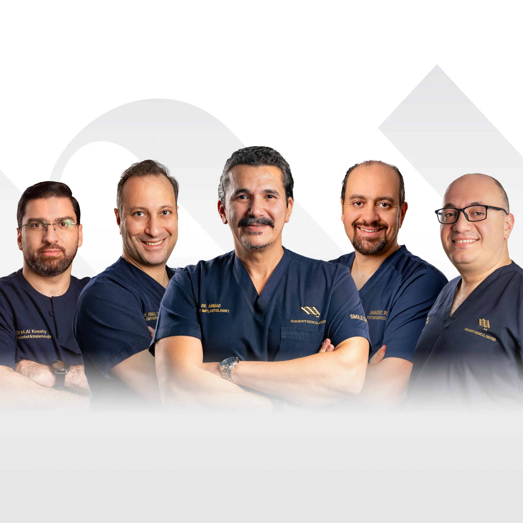 Harmony dental specialists in navy clinical uniforms